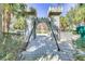 Community playground featuring a castle themed gate, bridge and playground area for residents to enjoy at 2784 Almaton Loop # 301, Kissimmee, FL 34747