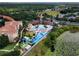 Aerial view of a pool with a water slide, clubhouse and lake views at 2784 Almaton Loop # 301, Kissimmee, FL 34747