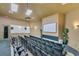 Community theater room featuring tiered seating, large screen and projector for viewing movies and entertainment at 2784 Almaton Loop # 301, Kissimmee, FL 34747
