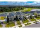 New construction homes with modern exteriors, landscaped lawns, and a serene neighborhood setting at 2807 Bookmark Dr, Kissimmee, FL 34746