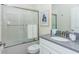 Bathroom with shower and tub combination, framed print, modern vanity and fixtures at 2807 Bookmark Dr, Kissimmee, FL 34746