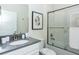 Sparkling clean bathroom with modern fixtures, white vanity, toilet, shower, and plenty of light at 2807 Bookmark Dr, Kissimmee, FL 34746