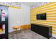 A bedroom with Mickey Mouse themed decor and a large-screen TV at 2807 Bookmark Dr, Kissimmee, FL 34746