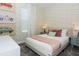Well decorated bedroom with colorful wallpaper and decor and comfortable furniture at 2807 Bookmark Dr, Kissimmee, FL 34746