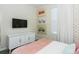 Bright, cheerful bedroom featuring colorful wallpaper, comfortable furniture and modern TV at 2807 Bookmark Dr, Kissimmee, FL 34746