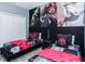 Charming bedroom features two twin beds, Star Wars themed decor and themed wall art at 2807 Bookmark Dr, Kissimmee, FL 34746