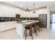 Contemporary kitchen featuring a large island with seating and stainless steel appliances at 2807 Bookmark Dr, Kissimmee, FL 34746