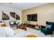 Bright living room with modern decor, accent wall, and comfortable seating arrangement at 2807 Bookmark Dr, Kissimmee, FL 34746