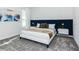 Modern bedroom with stylish headboard and plush carpet creating a relaxing space at 2807 Bookmark Dr, Kissimmee, FL 34746
