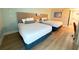 A cozy room featuring two double beds, a nightstand, and modern flooring for a comfortable stay at 3000 Maingate Ln # 227, Kissimmee, FL 34747