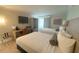 Inviting bedroom featuring two beds, a desk and chair, wardrobe, and TV for entertainment at 3000 Maingate Ln # 227, Kissimmee, FL 34747