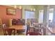 Relaxing dining room with natural light, offering a welcoming space for casual and formal dining at 3000 Maingate Ln # 227, Kissimmee, FL 34747
