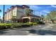 Beautiful hotel exterior with well-maintained landscaping, offering a welcoming and upscale ambiance at 3000 Maingate Ln # 227, Kissimmee, FL 34747