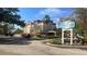 An inviting exterior view of the Galleria Palms Hotel under a partly cloudy bright blue sky at 3000 Maingate Ln # 227, Kissimmee, FL 34747