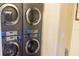 Close-up of modern laundry machines, showcasing the convenience of on-site laundry facilities at 3000 Maingate Ln # 227, Kissimmee, FL 34747