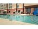 Inviting swimming pool with sun loungers, a tranquil retreat for enjoying sunny days at 3000 Maingate Ln # 227, Kissimmee, FL 34747