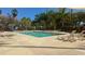 Serene swimming pool area surrounded by sun loungers, offering a perfect space for relaxation and soaking up the sun at 3000 Maingate Ln # 227, Kissimmee, FL 34747