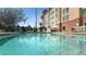 Refreshing swimming pool with ample lounge seating, creating a perfect oasis for relaxation and recreation at 3000 Maingate Ln # 227, Kissimmee, FL 34747