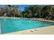 Large swimming pool with clear water and sun loungers, ideal for swimming and enjoying outdoor leisure at 3000 Maingate Ln # 227, Kissimmee, FL 34747