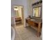 Elegant en suite bathroom features a double vanity, a tub, and modern finishes at 3026 Bella Vista Dr, Davenport, FL 33897
