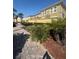 Landscaped walkway with tropical plants and stone pavers leads through the community at 3026 Bella Vista Dr, Davenport, FL 33897