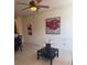 Living room with tile flooring, ceiling fan, and art at 3026 Bella Vista Dr, Davenport, FL 33897
