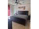 Stylish main bedroom with a decorative headboard and access to an outdoor space at 3026 Bella Vista Dr, Davenport, FL 33897