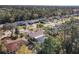 Lovely aerial view of a single-Gathering home showcasing its screened-in pool and mature landscaping in a quiet neighborhood at 3252 Noah St, Deltona, FL 32738