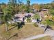 Scenic aerial shot of home showing lawn and landscaping, including tall palm trees, and neighborhood at 3252 Noah St, Deltona, FL 32738