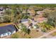 Overhead view of the home featuring a screened pool and fenced-in backyard, surrounded by trees in a neighborhood setting at 3252 Noah St, Deltona, FL 32738