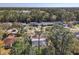 Aerial view of a single Gathering house with mature landscaping in a suburban neighborhood at 3252 Noah St, Deltona, FL 32738