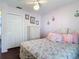 Bright bedroom features closet, floral bedding, and soft pink walls at 3252 Noah St, Deltona, FL 32738