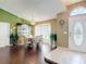 Dining room with wood floors, elegant chandelier, large windows, and space for entertaining at 3252 Noah St, Deltona, FL 32738