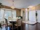 Formal dining area boasting dark hardwood floors, decorative lighting, and abundant natural light at 3252 Noah St, Deltona, FL 32738