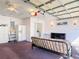Spacious garage with white walls and ceiling including a futon, refrigerator, and ladder at 3252 Noah St, Deltona, FL 32738