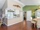 Open kitchen showcases a breakfast bar, tile floors, and bright dining space at 3252 Noah St, Deltona, FL 32738
