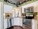 Contemporary kitchen with granite countertops, stainless appliances, and ample cabinets at 3252 Noah St, Deltona, FL 32738