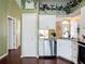 Bright kitchen with white cabinets, stainless appliances, and open layout at 3252 Noah St, Deltona, FL 32738