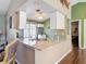 Modern kitchen with breakfast bar, granite counters, and ample cabinet space at 3252 Noah St, Deltona, FL 32738