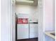 View of the laundry area through an open door showing a washing machine and dryer at 3252 Noah St, Deltona, FL 32738