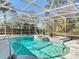 A screened-in pool area with a large pool, water feature, and space for entertaining at 3252 Noah St, Deltona, FL 32738