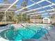Backyard in-ground swimming pool features a screened-in lanai at 3252 Noah St, Deltona, FL 32738