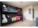bedroom featuring a stylish blue bunk bed with superhero themed bedding and artwork at 3428 Lilac Way, Davenport, FL 33897