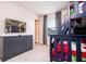 Fun bedroom with bunk beds, dresser, and wall mounted television for entertainment at 3428 Lilac Way, Davenport, FL 33897