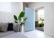 Inviting foyer with a view of the front yard, modern decor, and an open door concept at 3428 Lilac Way, Davenport, FL 33897