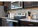 Kitchen featuring modern appliances, granite countertops, and an efficient cooking space at 3428 Lilac Way, Davenport, FL 33897