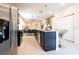Bright kitchen featuring granite counters, stainless appliances, and bar seating on the island at 3428 Lilac Way, Davenport, FL 33897