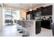 Kitchen with stainless steel appliances, breakfast bar, and easy access to the outdoor patio at 3428 Lilac Way, Davenport, FL 33897