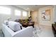Bright living room with modern seating, stylish decor, and an inviting ambiance perfect for relaxation and socializing at 3428 Lilac Way, Davenport, FL 33897