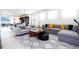 Well-lit living area features a stylish rug, comfortable seating, and an open layout for versatile arrangement and entertaining at 3428 Lilac Way, Davenport, FL 33897